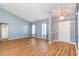 Bright, open living room features hardwood floors, vaulted ceiling and lots of natural light at 180 Oak Crest Circle, Longs, SC 29568