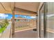 Charming covered balcony featuring wood floors and ample space for outdoor seating with views of the community at 1801 N Ocean Blvd. # A4, North Myrtle Beach, SC 29582