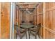 Unfinished basement with a table and chairs, framed by exposed wooden beams at 1801 N Ocean Blvd. # A4, North Myrtle Beach, SC 29582