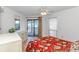 Bedroom with sliding glass door to a balcony and a view of the water at 1801 N Ocean Blvd. # A4, North Myrtle Beach, SC 29582