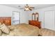 Bedroom features wood floors, a ceiling fan, and warm-toned furniture at 1801 N Ocean Blvd. # A4, North Myrtle Beach, SC 29582
