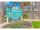 Welcoming community sign amidst tropical foliage and colorful flowerbeds at 1801 N Ocean Blvd. # A4, North Myrtle Beach, SC 29582