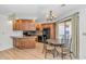 Bright eat-in kitchen with sleek appliances, wood cabinets, and a dining area with access to outdoor space at 1801 N Ocean Blvd. # A4, North Myrtle Beach, SC 29582