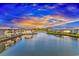 Scenic waterfront condos overlooking a serene waterway with lush landscaping under a colorful sky at 1801 N Ocean Blvd. # A4, North Myrtle Beach, SC 29582