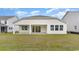 A spacious backyard featuring a covered patio and ample green space at 1804 Hardwood Ct., Conway, SC 29526