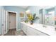 Bright bathroom featuring dual sinks, white cabinets, modern fixtures, and stylish decor at 1804 Hardwood Ct., Conway, SC 29526
