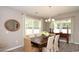 Dining room with a traditional table, chandelier, and window views at 1804 Hardwood Ct., Conway, SC 29526