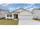 Charming single-story home featuring a two-car garage, arched entryway, and well-manicured lawn at 1804 Hardwood Ct., Conway, SC 29526