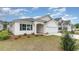 A lovely single-story home featuring a manicured lawn and attached two-car garage at 1804 Hardwood Ct., Conway, SC 29526