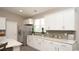 Contemporary kitchen featuring granite countertops, white cabinetry, and stainless steel appliances at 1804 Hardwood Ct., Conway, SC 29526