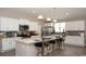 Bright and airy kitchen featuring granite countertops, stainless steel appliances, and stylish bar stools at 1804 Hardwood Ct., Conway, SC 29526
