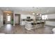 Open kitchen featuring a center island with bar seating, white cabinetry, and tile flooring at 1804 Hardwood Ct., Conway, SC 29526