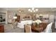 Open-concept living and dining area with modern lighting and decor, and access to other rooms in the home at 1804 Hardwood Ct., Conway, SC 29526