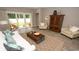 View of the living room featuring a stylish coffee table, ample seating, and easy access to the outdoor patio at 1804 Hardwood Ct., Conway, SC 29526