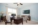 Bright office space with a dark desk, two patterned chairs, and a wall mounted tv at 1804 Hardwood Ct., Conway, SC 29526