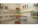 Walk-in pantry with wire shelving, providing ample storage space for food, drinks, and other kitchen essentials at 1804 Hardwood Ct., Conway, SC 29526