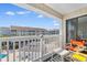Balcony view overlooking a community pool and resort buildings at 191 Maison Dr. # B-319, Myrtle Beach, SC 29572