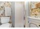 Bathroom with toilet, shower and vanity with sink and vanity lights at 191 Maison Dr. # B-319, Myrtle Beach, SC 29572