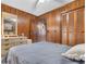 Comfortable bedroom featuring wood paneling and neutral decor at 191 Maison Dr. # B-319, Myrtle Beach, SC 29572