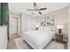Bright bedroom features a ceiling fan, closet, and stylish decor, creating a cozy and inviting space at 201-F Madison Ct., Myrtle Beach, SC 29577