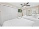 Spacious bedroom has two beds, a ceiling fan, and ample closet space for convenience at 201-F Madison Ct., Myrtle Beach, SC 29577