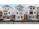 Coastal townhomes with modern design elements, outdoor seating, and well-manicured landscaping at 201-F Madison Ct., Myrtle Beach, SC 29577