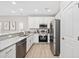 Modern kitchen with stainless steel appliances, granite countertops, and white cabinets at 201-F Madison Ct., Myrtle Beach, SC 29577