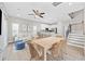 Inviting living room flowing into the kitchen featuring hardwood floors, neutral decor, and ample natural light at 201-F Madison Ct., Myrtle Beach, SC 29577