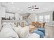 Open-concept living room featuring hardwood floors, and adjacent kitchen area at 201-F Madison Ct., Myrtle Beach, SC 29577