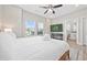 Comfortable bedroom with natural light, a ceiling fan, and a view of the ocean at 201-F Madison Ct., Myrtle Beach, SC 29577
