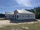 New home construction shows the initial framing stage, the roof with protective covering, and prepped yard at 204 Shady Pines Ct., Conway, SC 29527
