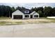 Charming new construction with a modern farmhouse design, black windows, and an attached two-car garage at 204 Shady Pines Ct., Conway, SC 29527