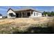 New home construction shows the initial framing stage, the roof with protective covering, and prepped yard at 204 Shady Pines Ct., Conway, SC 29527