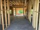 Unfinished new construction interior shows framing and placement of windows with a view of wooded area at 204 Shady Pines Ct., Conway, SC 29527
