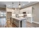 Modern kitchen with white cabinets, stainless steel appliances and a gray island with a white countertop at 204 Shady Pines Ct., Conway, SC 29527