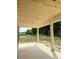 View of patio with wood-paneled ceiling, columns, and concrete flooring, showing a beautiful outdoor living space at 204 Shady Pines Ct., Conway, SC 29527