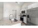Kitchen features white cabinetry, granite countertops, stainless steel appliances, and a large island sink at 205 Gray Owl Dr., Conway, SC 29527