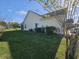View of backyard showing the home's siding, lawn, and well-maintained landscape at 213 Cupola Dr., Longs, SC 29568