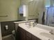 Standard bathroom featuring double sinks, large vanity mirror and shower with curtain at 213 Cupola Dr., Longs, SC 29568
