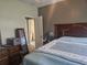 Bedroom featuring light walls, decorative wooden headboard and standard closet at 213 Cupola Dr., Longs, SC 29568