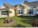Well-maintained front yard with a palm tree accenting the facade of this lovely home at 213 Cupola Dr., Longs, SC 29568