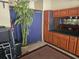 Garage featuring a custom wood cabinet with countertop, mirror, and storage capacity at 213 Cupola Dr., Longs, SC 29568