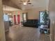 Cozy living room featuring vaulted ceiling, laminate flooring, and lots of light at 213 Cupola Dr., Longs, SC 29568