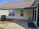 A backyard patio featuring a retractable awning, barbeque grill and furniture at 213 Cupola Dr., Longs, SC 29568