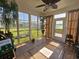 Bright sun room with large windows offering pleasant views of the backyard and a tile floor at 213 Cupola Dr., Longs, SC 29568