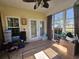 Enclosed sunroom with ceiling fan, tiled floor and glass windows at 213 Cupola Dr., Longs, SC 29568