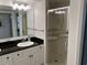 Bright bathroom featuring a single sink, granite countertops, vanity with storage, and glass enclosed shower at 2151 Bridgeview Ct. # 3-305, North Myrtle Beach, SC 29582