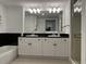 Bathroom featuring dual sinks, granite countertops, vanity with storage, and glass enclosed shower at 2151 Bridgeview Ct. # 3-305, North Myrtle Beach, SC 29582