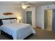 Bright bedroom featuring a queen bed, ceiling fan, closet, and en suite bath at 2151 Bridgeview Ct. # 3-305, North Myrtle Beach, SC 29582