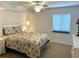 Comfortable bedroom with ceiling fan and window provides a relaxing space at 2151 Bridgeview Ct. # 3-305, North Myrtle Beach, SC 29582